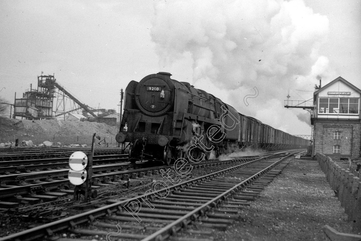 WD2654 
 ENGINE CLASS: BR Class 9 ENGINE NUMBER: 92110 LOCATION: Carnforth DATE: 26 November 1966 COMMENTS: 
 Keywords: 26 November 1966, 92110, BR Class 9, Carnforth, Cooperline, Steam, WD Cooper, locomotives, railway photography, trains