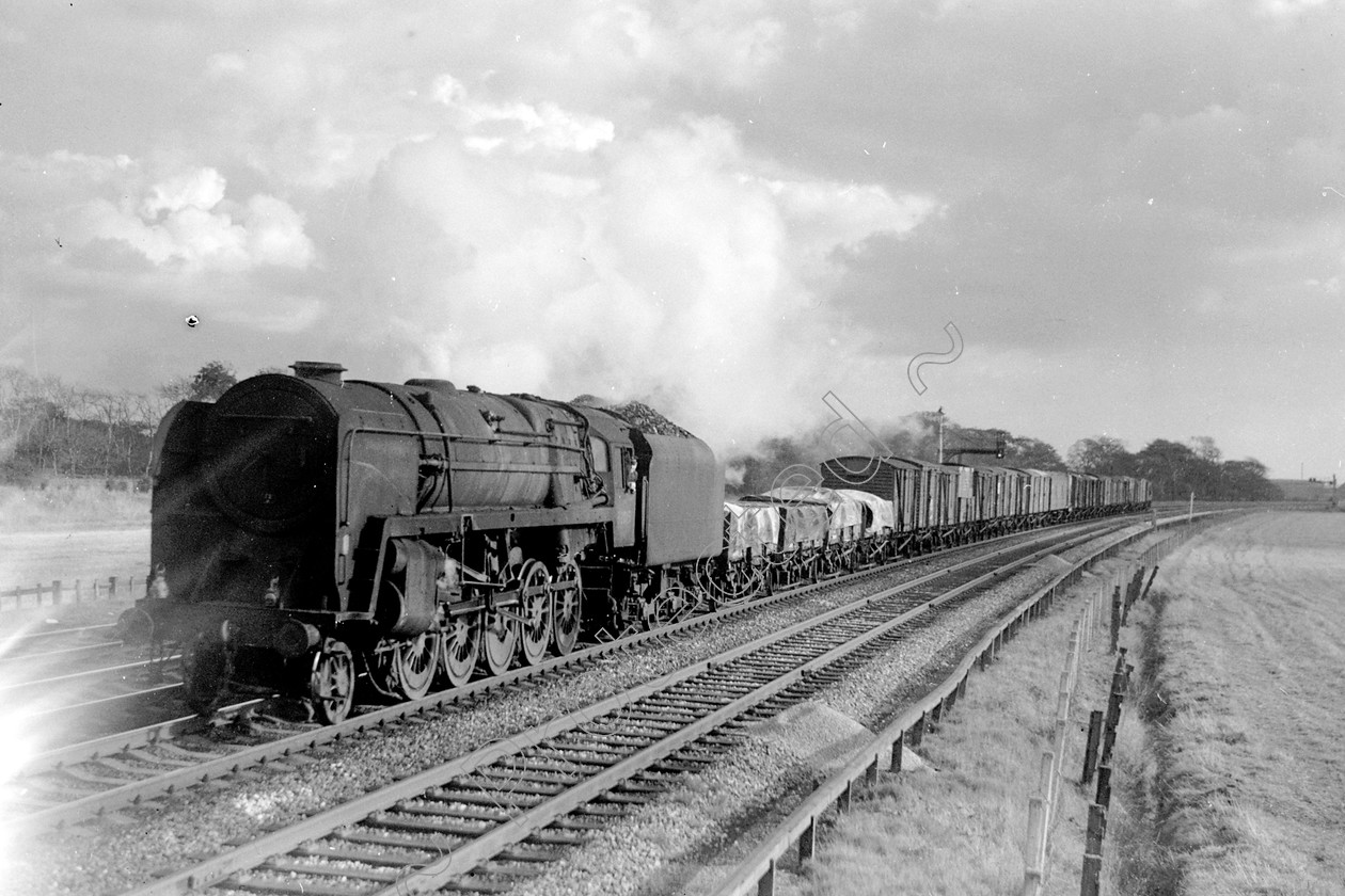 WD2610 
 ENGINE CLASS: BR Class 9 ENGINE NUMBER: 92015 LOCATION: Winwick DATE: 15 October 1965 COMMENTS: 
 Keywords: 15 October 1965, 92015, BR Class 9, Cooperline, Steam, WD Cooper, Winwick, locomotives, railway photography, trains