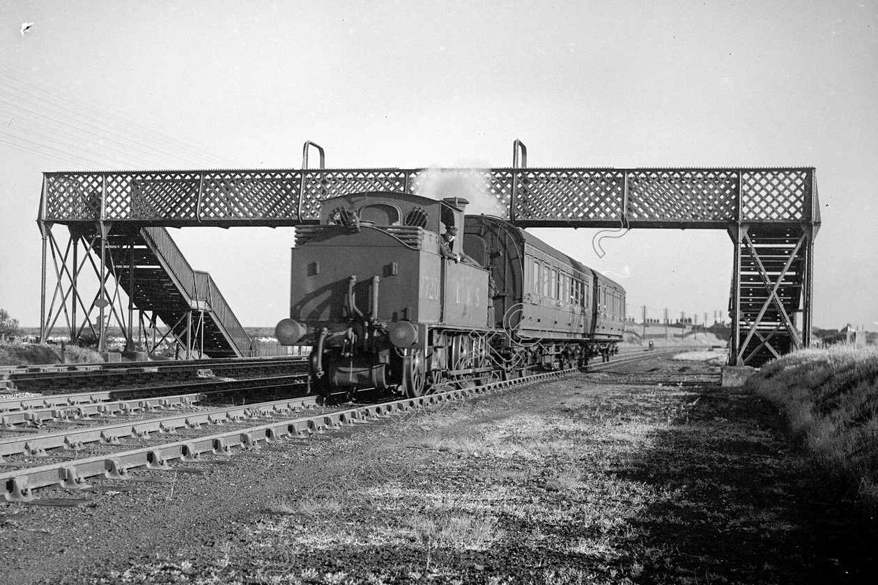 WD0920 
 ENGINE CLASS: L.N.W.R. ENGINE NUMBER: 7720 LOCATION: Golborne DATE: 10 September 1945 COMMENTS: 
 Keywords: 10 September 1945, 7720, Cooperline, Golborne, L.N.W.R., Steam, WD Cooper, locomotives, railway photography, trains