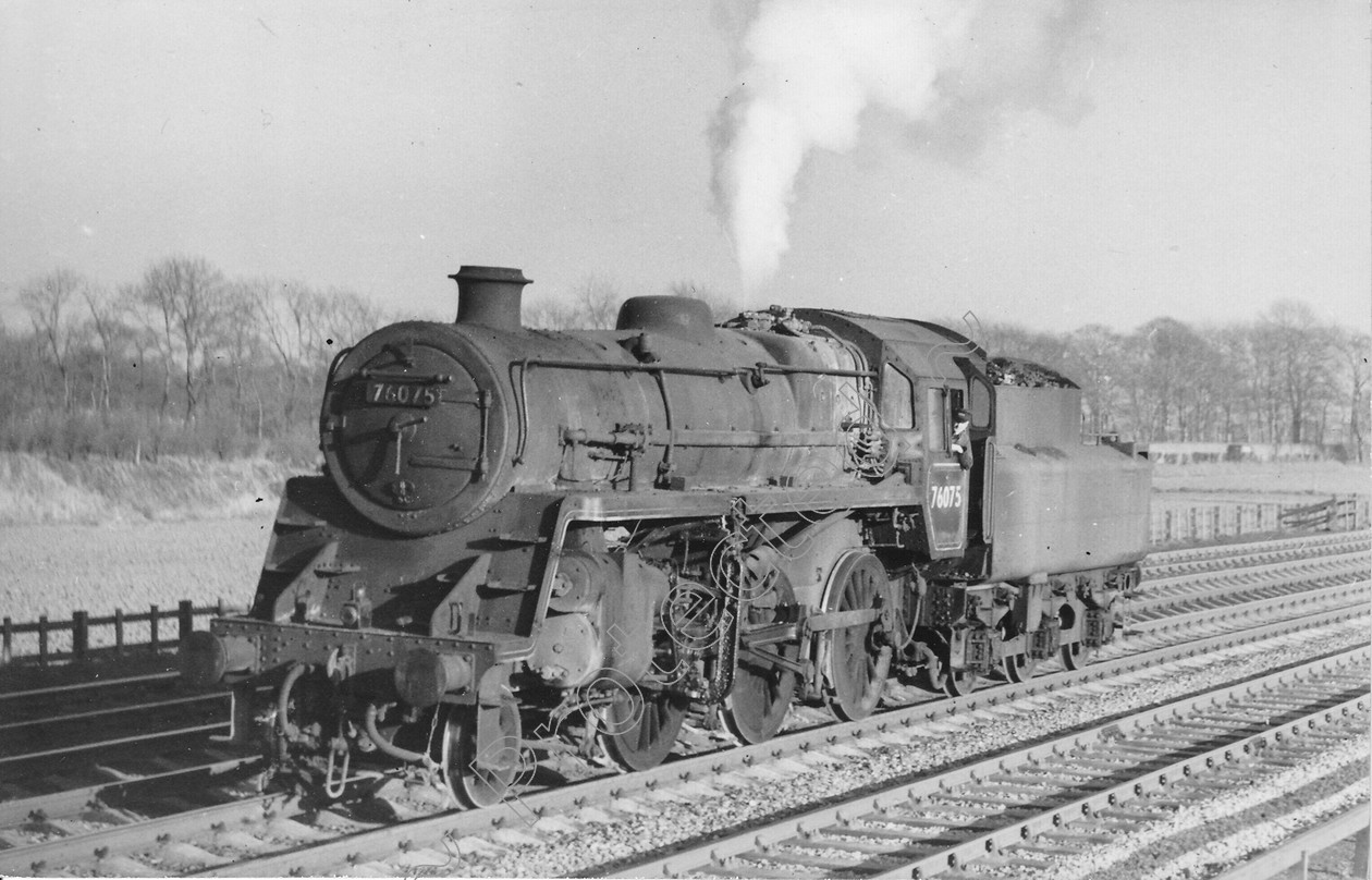 WD0693 
 ENGINE CLASS: Moguls 2-6-0 ENGINE NUMBER: 76075 LOCATION: Winwick DATE: 16 March 1961 COMMENTS: 
 Keywords: 16 March 1961, 76075, Cooperline, Moguls 2-6-0, Steam, WD Cooper, Winwick, locomotives, railway photography, trains