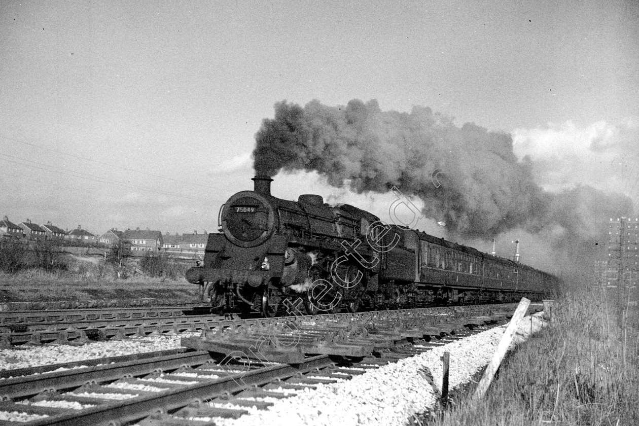 WD2492 
 ENGINE CLASS: BR 75000 4-6-0 ENGINE NUMBER: 75049 LOCATION: Walkden DATE: 21 March 1966 COMMENTS: 
 Keywords: 21 March 1966, 75049, BR 75000 4-6-0, Cooperline, Steam, WD Cooper, Walkden, locomotives, railway photography, trains