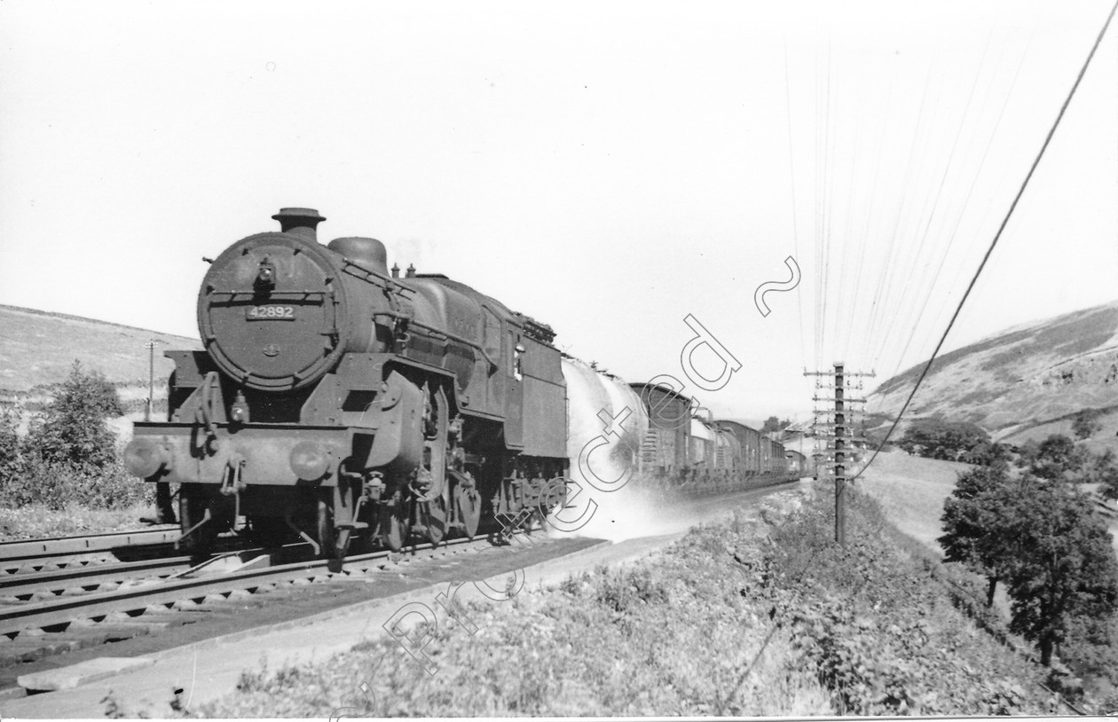 WD0658 
 ENGINE CLASS: Moguls 2-6-0 ENGINE NUMBER: 42892 LOCATION: Dillicar DATE: 26 August 1959 COMMENTS: 
 Keywords: 26 August 1959, 42892, Cooperline, Dillicar, Moguls 2-6-0, Steam, WD Cooper, locomotives, railway photography, trains