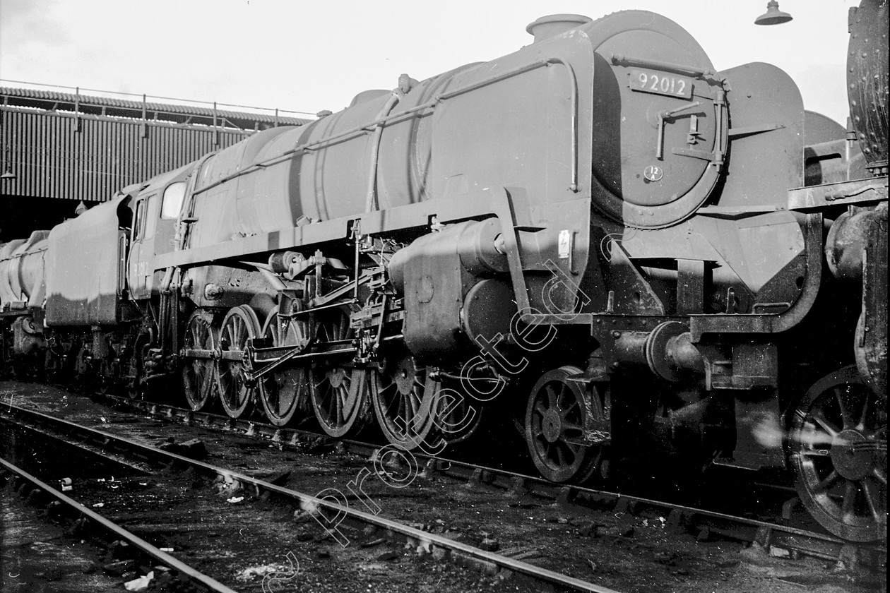 WD2609 
 ENGINE CLASS: BR Class 9 ENGINE NUMBER: 92012 LOCATION: Patricroft DATE: 01 October 1966 COMMENTS: 
 Keywords: 01 October 1966, 92012, BR Class 9, Cooperline, Patricroft, Steam, WD Cooper, locomotives, railway photography, trains