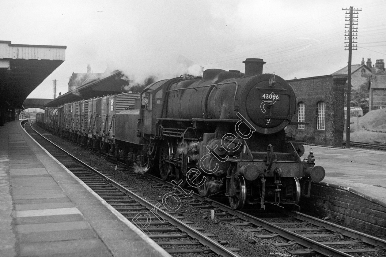 WD0897 
 ENGINE CLASS: Ivatt 6400 & 3000 ENGINE NUMBER: 43066 LOCATION: Carnforth DATE: 21 May 1965 COMMENTS: 
 Keywords: 21 May 1965, 43066, Carnforth, Cooperline, Ivatt 6400 & 3000, Steam, WD Cooper, locomotives, railway photography, trains