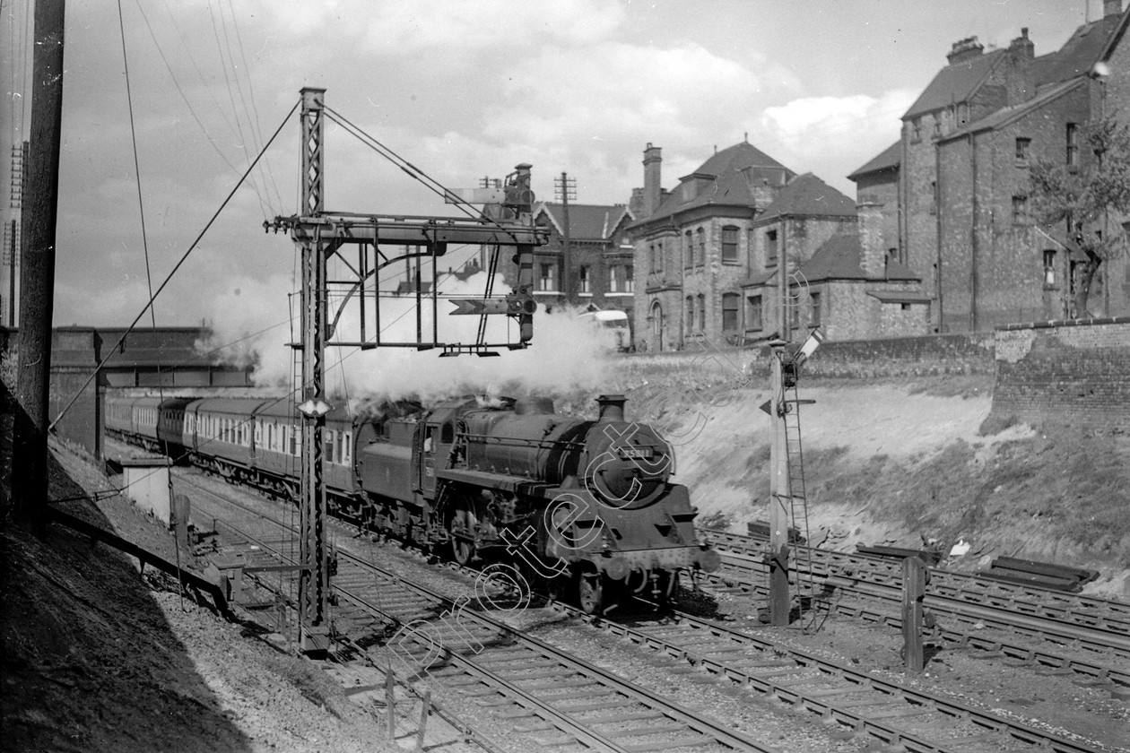 WD2463 
 ENGINE CLASS: BR 75000 4-6-0 ENGINE NUMBER: 75011 LOCATION: Eccles DATE: 06 May 1957 COMMENTS: 
 Keywords: 06 May 1957, 75011, BR 75000 4-6-0, Cooperline, Eccles, Steam, WD Cooper, locomotives, railway photography, trains