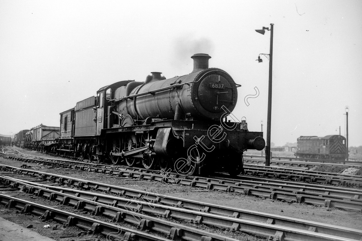 WD2820 
 ENGINE CLASS: GWR ENGINE NUMBER: 6837 LOCATION: Mold Junction DATE: 27 May 1964 COMMENTS: 
 Keywords: 27 May 1964, 6837, Cooperline, GWR, Mold Junction, Steam, WD Cooper, locomotives, railway photography, trains