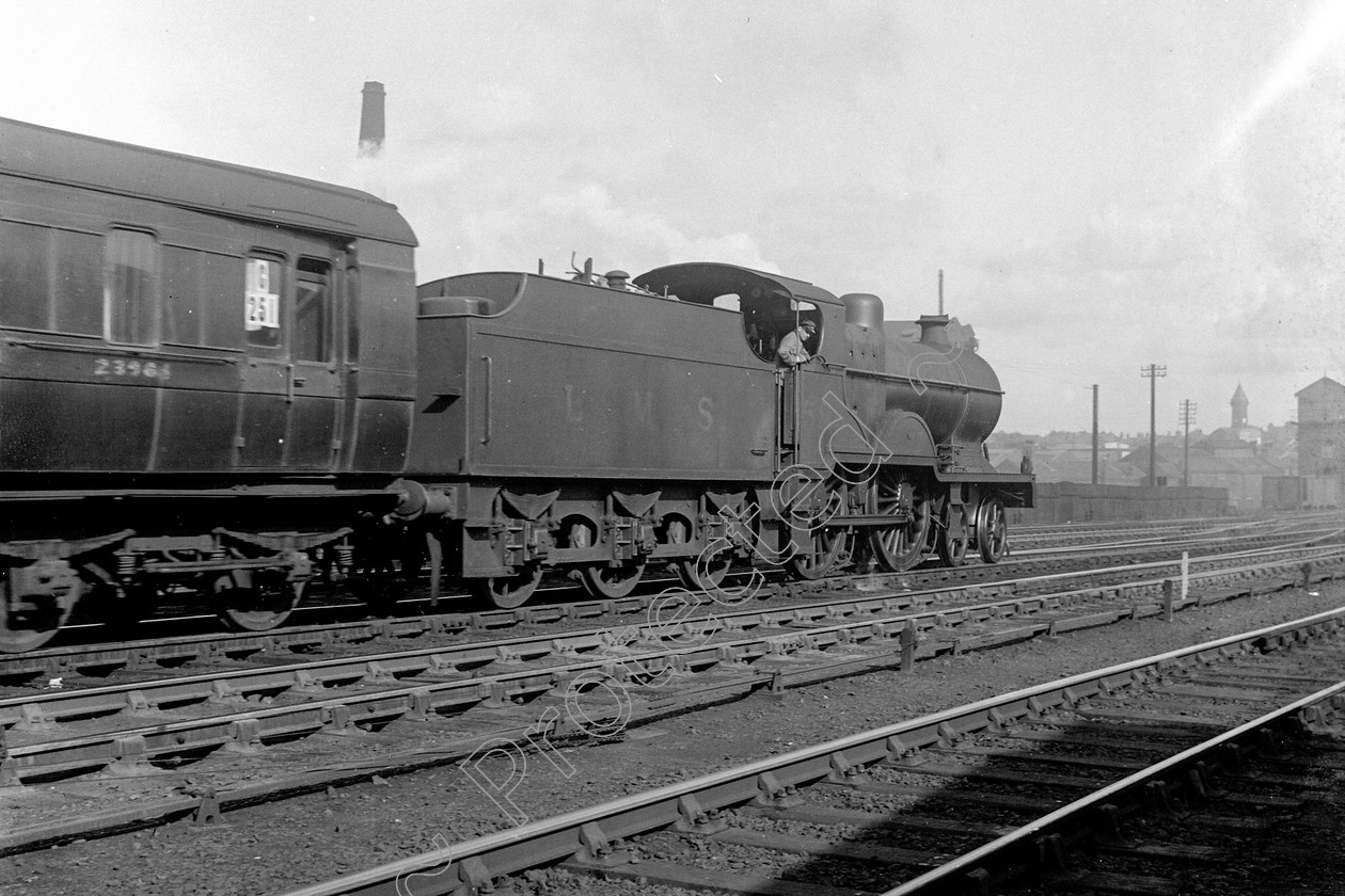 WD0573 
 ENGINE CLASS: Class 2 4-4-0 ENGINE NUMBER: 585 LOCATION: Preston DATE: 01 July 1939 COMMENTS: 
 Keywords: 01 July 1939, 585, Class 2 4-4-0, Cooperline, Preston, Steam, WD Cooper, locomotives, railway photography, trains