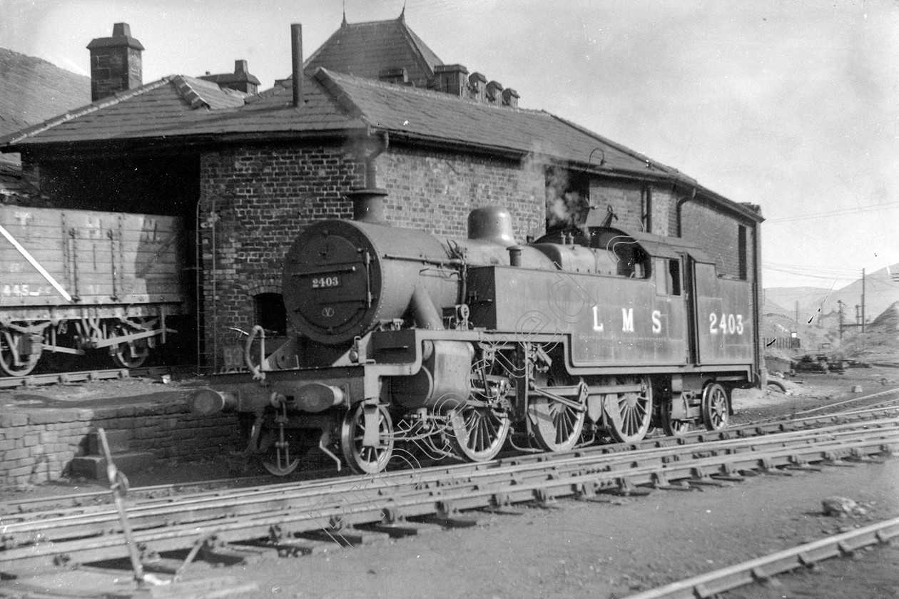 WD1002 
 ENGINE CLASS: 2-6-4 Tanks ENGINE NUMBER: 2403 LOCATION: Tebay DATE: 31 July 1947 COMMENTS: 
 Keywords: 2-6-4 Tanks, 2403, 31 July 1947, Cooperline, Steam, Tebay, WD Cooper, locomotives, railway photography, trains