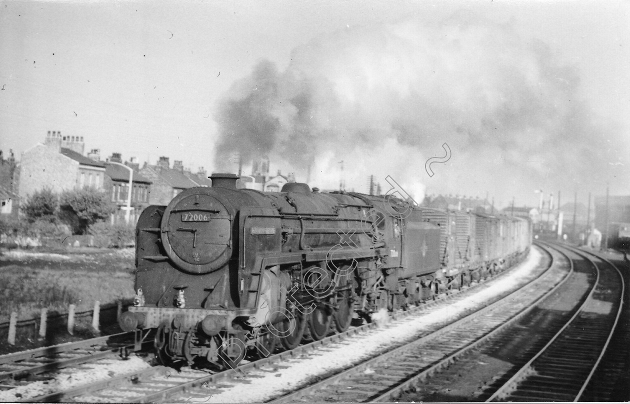 WD1383 
 ENGINE CLASS: Clan Class ENGINE NUMBER: 72006 LOCATION: Patricroft DATE: 15 May 1964 COMMENTS: curve by shed 
 Keywords: 15 May 1964, 72006, Clan Class, Cooperline, Patricroft, Steam, WD Cooper, curve by shed, locomotives, railway photography, trains