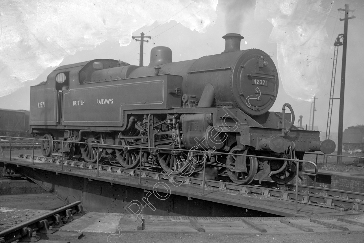 WD1038 
 ENGINE CLASS: 2-6-4 Tanks ENGINE NUMBER: 42371 LOCATION: Longsight DATE: 10 October 1951 COMMENTS: 
 Keywords: 10 October 1951, 2-6-4 Tanks, 42371, Cooperline, Longsight, Steam, WD Cooper, locomotives, railway photography, trains