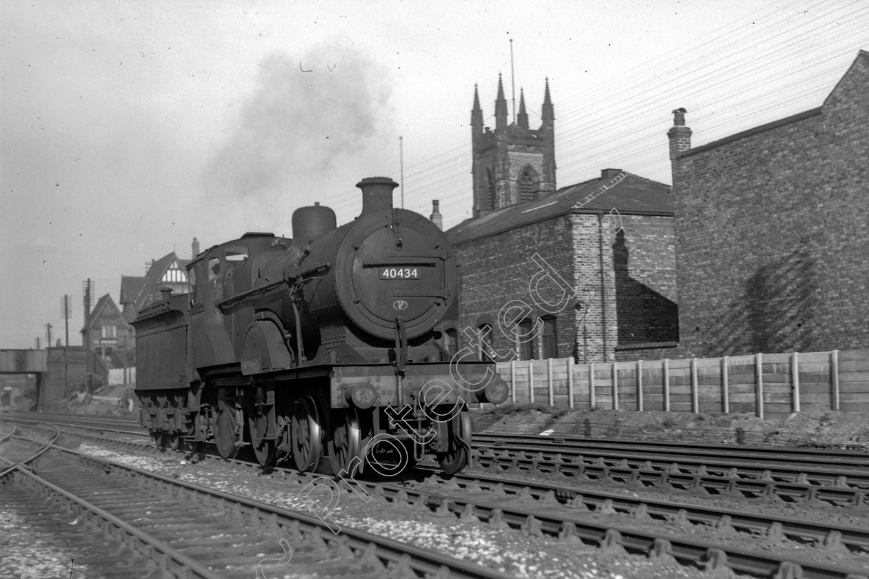 WD0563 
 ENGINE CLASS: Class 2 4-4-0 ENGINE NUMBER: 40434 LOCATION: Patricroft DATE: 03 May 1949 COMMENTS: 
 Keywords: 03 May 1949, 40434, Class 2 4-4-0, Cooperline, Patricroft, Steam, WD Cooper, locomotives, railway photography, trains