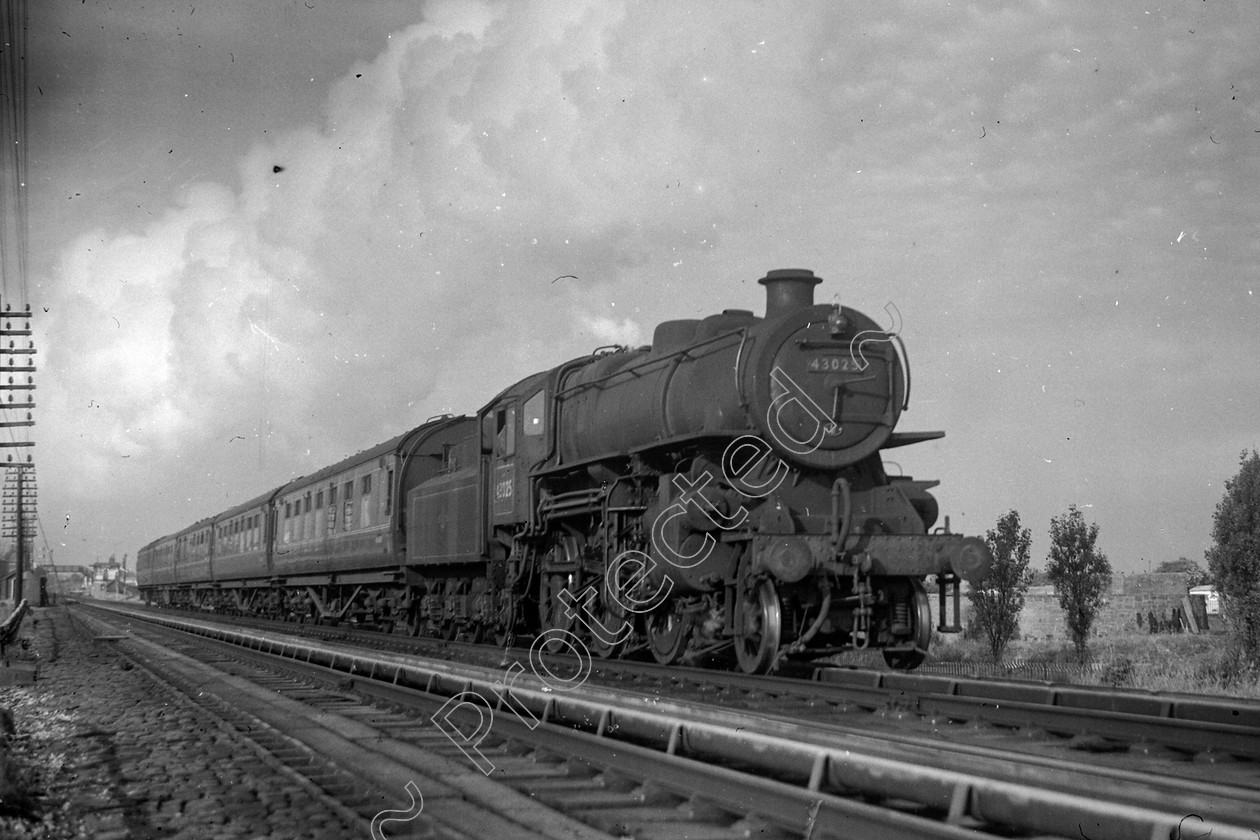 WD0888 
 ENGINE CLASS: Ivatt 6400 & 3000 ENGINE NUMBER: 43025 LOCATION: Hest Bank DATE: 18 June 1960 COMMENTS: 
 Keywords: 18 June 1960, 43025, Cooperline, Hest bank, Ivatt 6400 & 3000, Steam, WD Cooper, locomotives, railway photography, trains