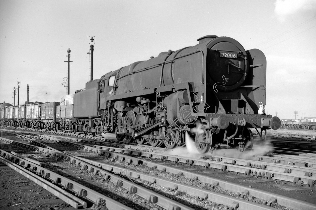 WD2603 
 ENGINE CLASS: BR Class 9 ENGINE NUMBER: 92006 LOCATION: Patricroft DATE: 18 January 1967 COMMENTS: 
 Keywords: 18 January 1967, 92006, BR Class 9, Cooperline, Patricroft, Steam, WD Cooper, locomotives, railway photography, trains