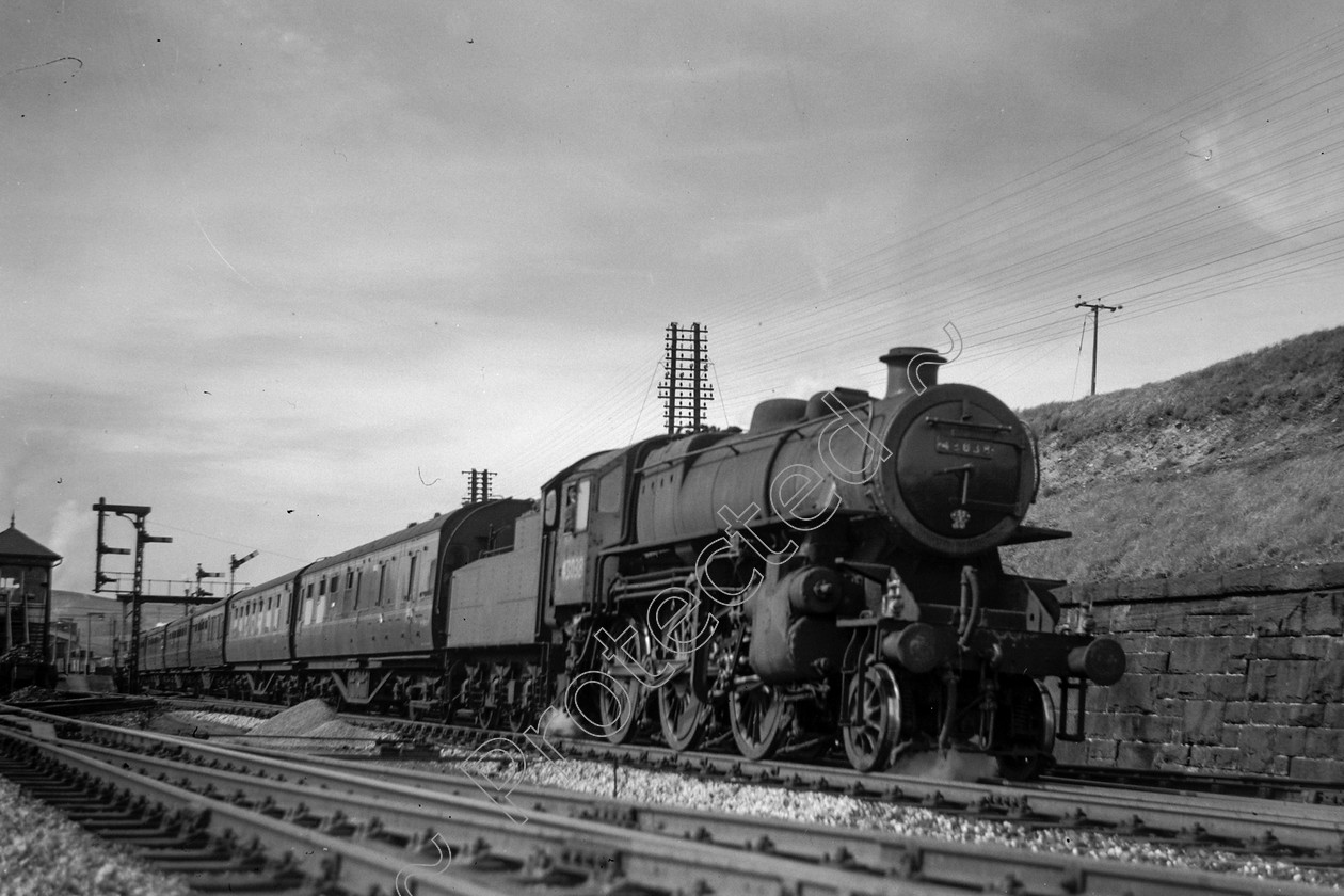 WD0893 
 ENGINE CLASS: Ivatt 6400 & 3000 ENGINE NUMBER: 43038 LOCATION: Hellifield DATE: 12 May 1961 COMMENTS: 
 Keywords: 12 May 1961, 43038, Cooperline, Hellifield, Ivatt 6400 & 3000, Steam, WD Cooper, locomotives, railway photography, trains