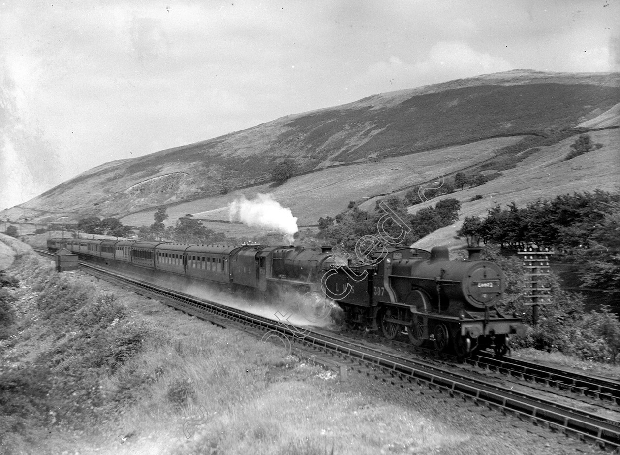 WDDH0957 
 ENGINE CLASS: Double Headed ENGINE NUMBER: 5309, 397 LOCATION: Dillicar DATE: 01 August 1947 COMMENTS: 
 Keywords: 01 August 1947, 397, 5309, Cooperline, Dillicar, Double Headed, Steam, WD Cooper, locomotives, railway photography, trains