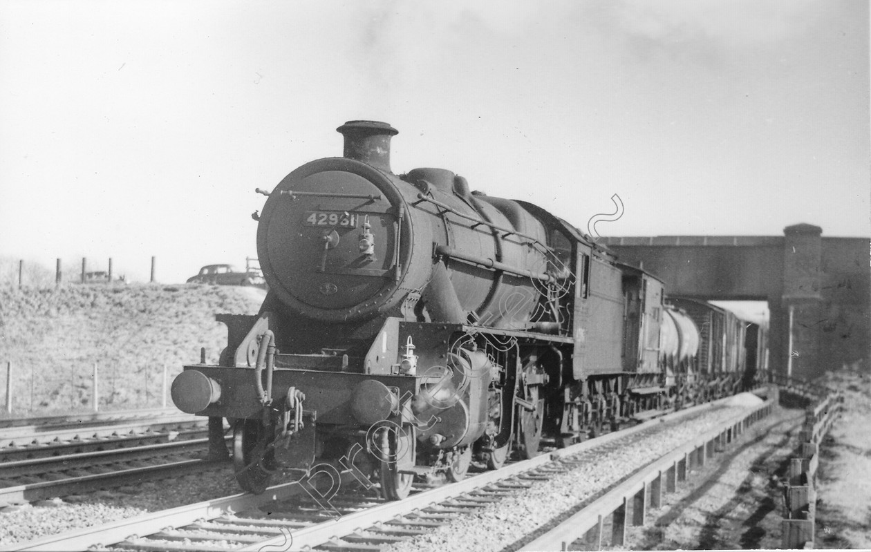 WD0674 
 ENGINE CLASS: Moguls 2-6-0 ENGINE NUMBER: 42961 LOCATION: Winwick DATE: 29 March 1965 COMMENTS: 
 Keywords: 29 March 1965, 42961, Cooperline, Moguls 2-6-0, Steam, WD Cooper, Winwick, locomotives, railway photography, trains