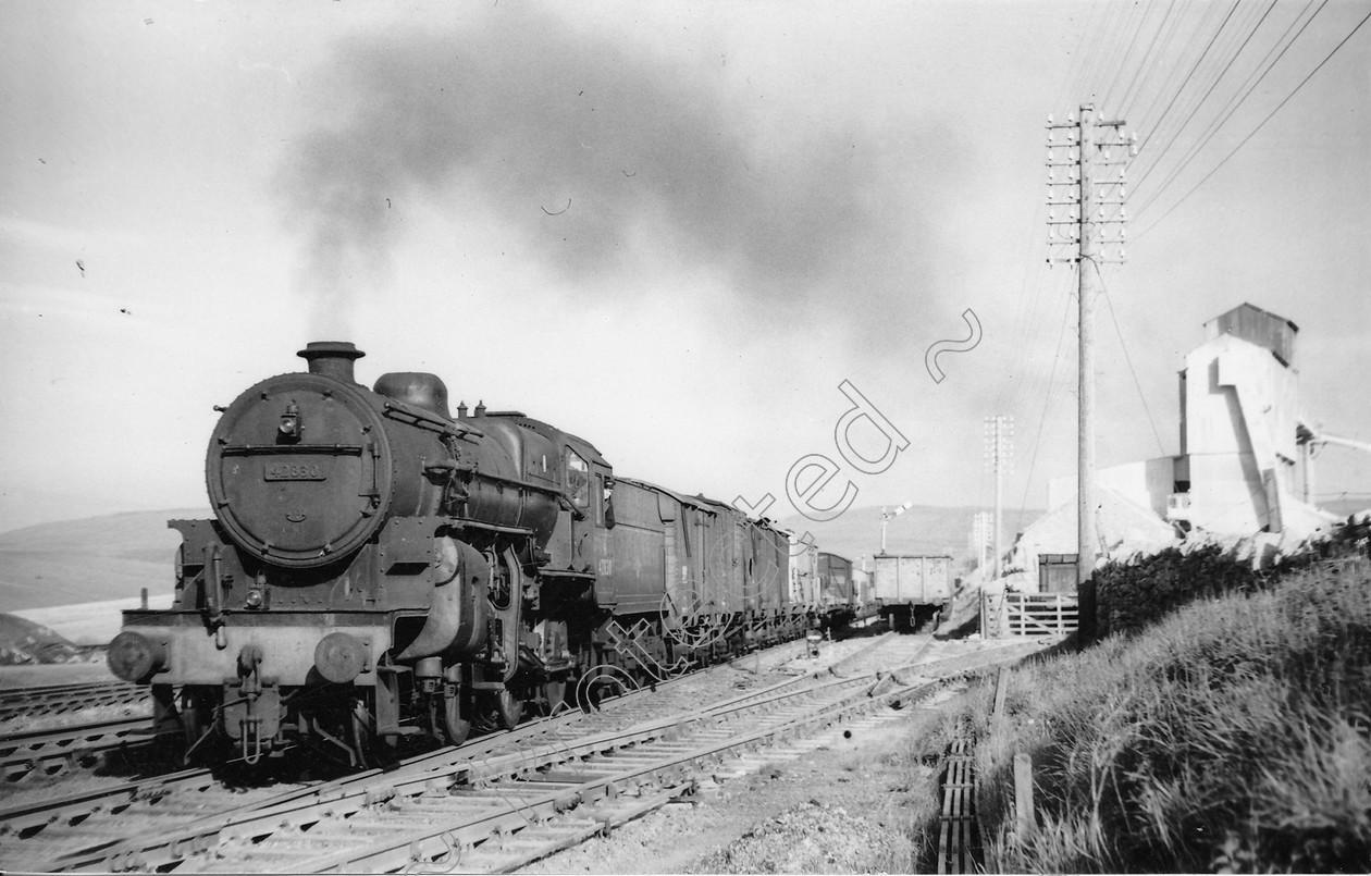 WD0644 
 ENGINE CLASS: Moguls 2-6-0 ENGINE NUMBER: 42830 LOCATION: Ribblehead DATE: 15 May 1961 COMMENTS: 
 Keywords: 15 May 1961, 42830, Cooperline, Moguls 2-6-0, Ribblehead, Steam, WD Cooper, locomotives, railway photography, trains