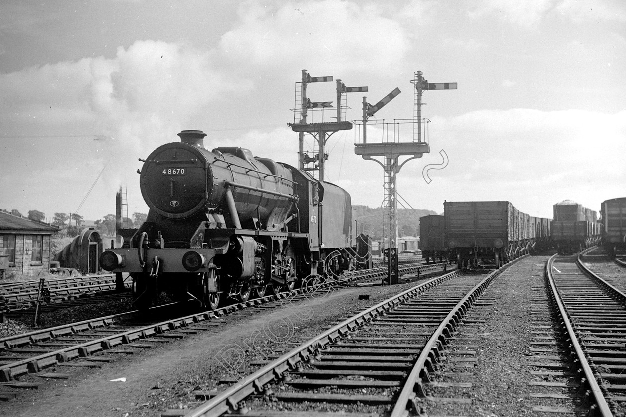 WD2070 
 ENGINE CLASS: Stanier Class 8 2-8-0 ENGINE NUMBER: 48670 LOCATION: Hellifield DATE: 00.07.1952 COMMENTS: 
 Keywords: 00.07.1952, 48670, Cooperline, Hellifield, Stanier Class 8 2-8-0, Steam, WD Cooper, locomotives, railway photography, trains