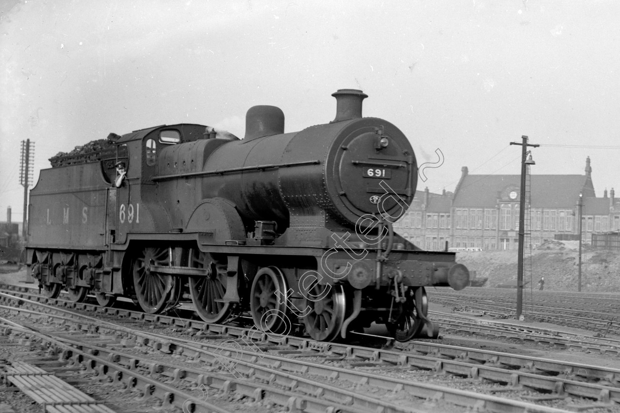 WD0557 
 ENGINE CLASS: Class 2 4-4-0 ENGINE NUMBER: 691 LOCATION: Newton Heath DATE: 12 May 1949 COMMENTS: 
 Keywords: 12 May 1949, 691, Class 2 4-4-0, Cooperline, Newton Heath, Steam, WD Cooper, locomotives, railway photography, trains