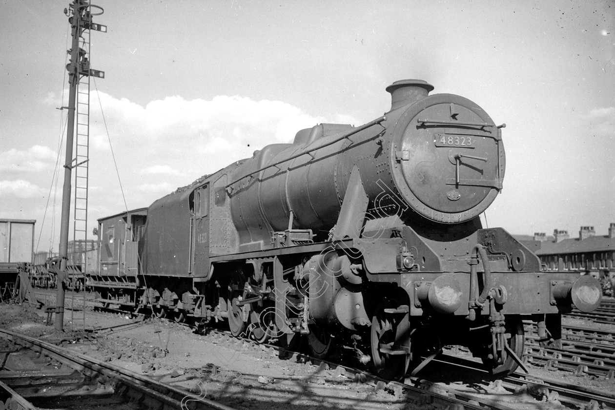 WD2031 
 ENGINE CLASS: Stanier Class 8 2-8-0 ENGINE NUMBER: 48323 LOCATION: Patricroft DATE: 17 June 1959 COMMENTS: 
 Keywords: 17 June 1959, 48323, Cooperline, Patricroft, Stanier Class 8 2-8-0, Steam, WD Cooper, locomotives, railway photography, trains