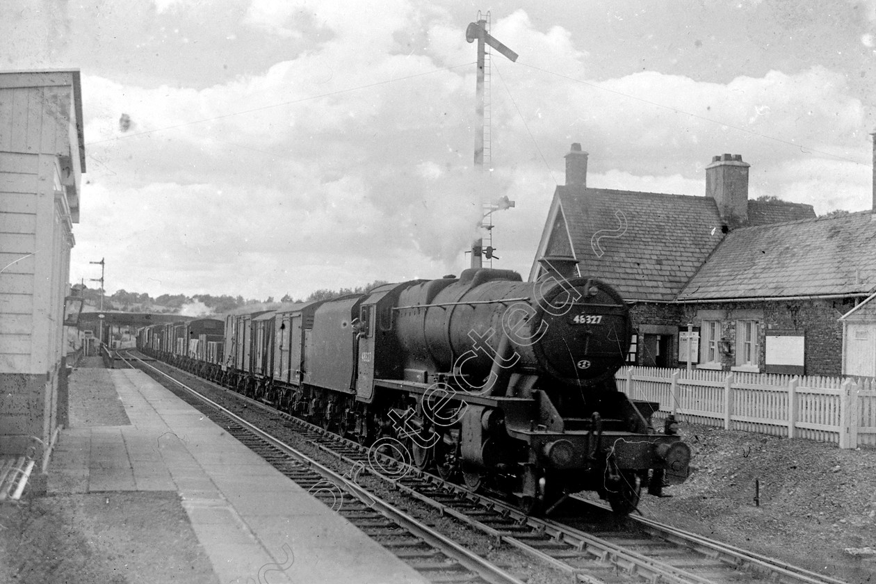 WD2033 
 ENGINE CLASS: Stanier Class 8 2-8-0 ENGINE NUMBER: 48327 LOCATION: Grayrigg DATE: 00.08.1949 COMMENTS: 
 Keywords: 00.08.1949, 48327, Cooperline, Grayrigg, Stanier Class 8 2-8-0, Steam, WD Cooper, locomotives, railway photography, trains