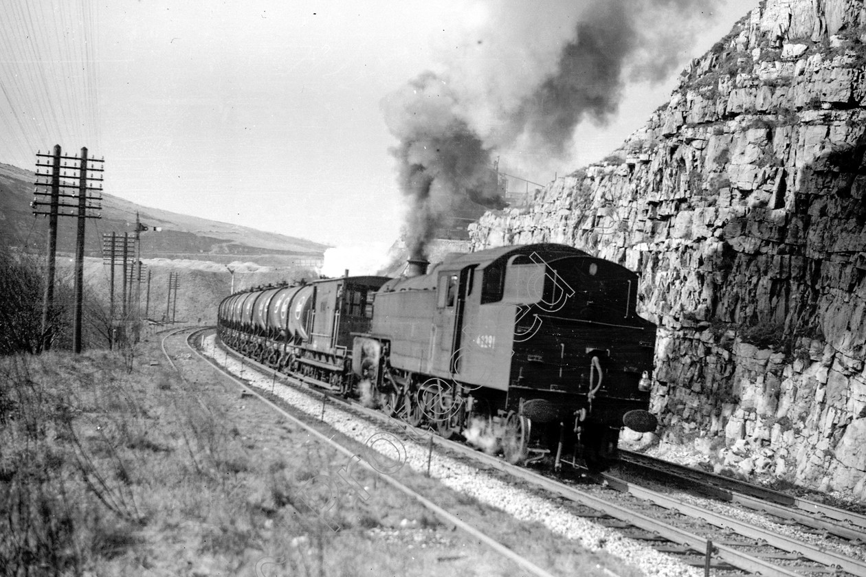 WD1025 
 ENGINE CLASS: 2-6-4 Tanks ENGINE NUMBER: 42291 LOCATION: Cheedale DATE: 23 March 1963 COMMENTS: 
 Keywords: 2-6-4 Tanks, 23 March 1963, 42291, Cheedale, Cooperline, Steam, WD Cooper, locomotives, railway photography, trains