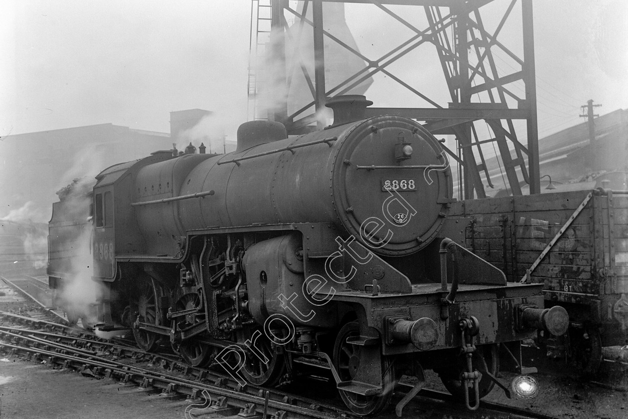 WD0606 
 ENGINE CLASS: Moguls 2-6-0 ENGINE NUMBER: 2868 LOCATION: Preston DATE: 17 February 1945 COMMENTS: 
 Keywords: 17 February 1945, 2868, Cooperline, Moguls 2-6-0, Preston, Steam, WD Cooper, locomotives, railway photography, trains