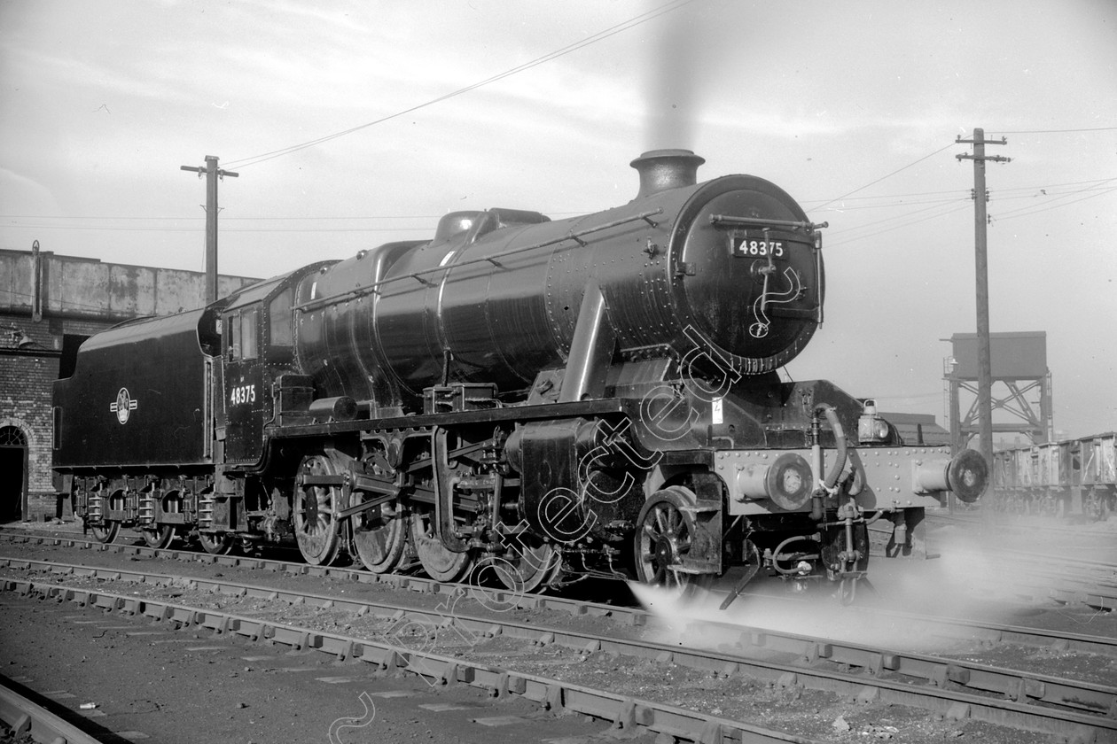 WD2040 
 ENGINE CLASS: Stanier Class 8 2-8-0 ENGINE NUMBER: 48375 LOCATION: Patricroft DATE: 10 May 1965 COMMENTS: 
 Keywords: 10 May 1965, 48375, Cooperline, Patricroft, Stanier Class 8 2-8-0, Steam, WD Cooper, locomotives, railway photography, trains