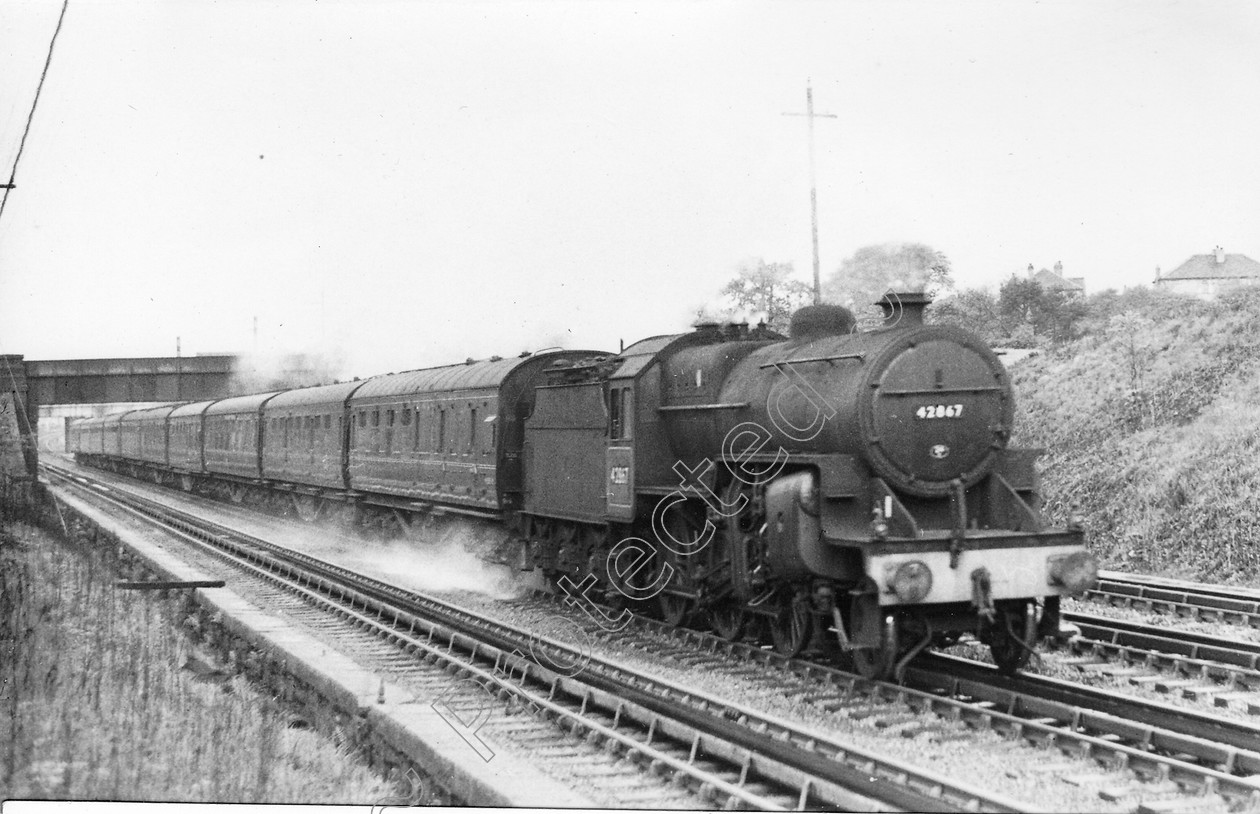 WD0652 
 ENGINE CLASS: Moguls 2-6-0 ENGINE NUMBER: 42867 LOCATION: Walkden Troughs DATE: 29 April 1960 COMMENTS: 
 Keywords: 29 April 1960, 42867, Cooperline, Moguls 2-6-0, Steam, WD Cooper, Walkden Troughs, locomotives, railway photography, trains