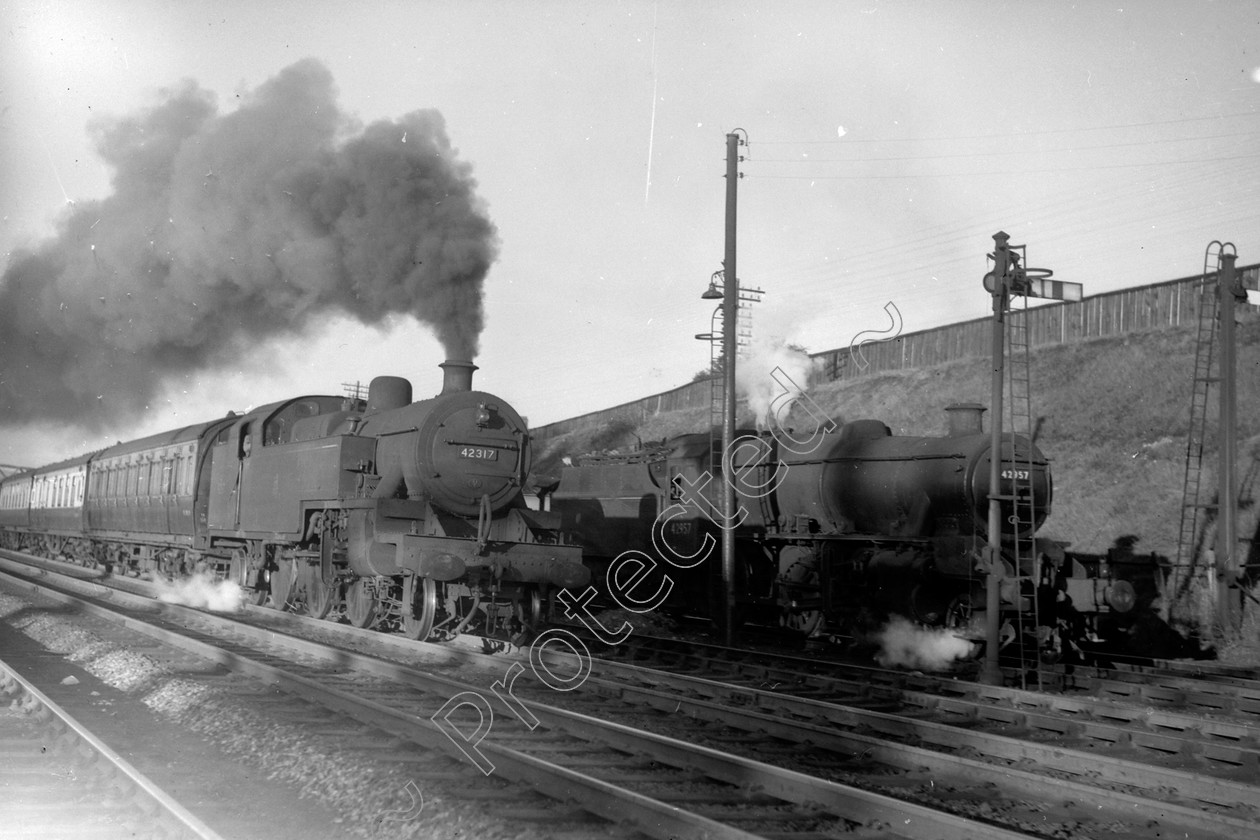 WD1032 
 ENGINE CLASS: 2-6-4 Tanks ENGINE NUMBER: 42317 LOCATION: Carnforth DATE: 00.05.1949 COMMENTS: 
 Keywords: 00.05.1949, 2-6-4 Tanks, 42317, Carnforth, Cooperline, Steam, WD Cooper, locomotives, railway photography, trains