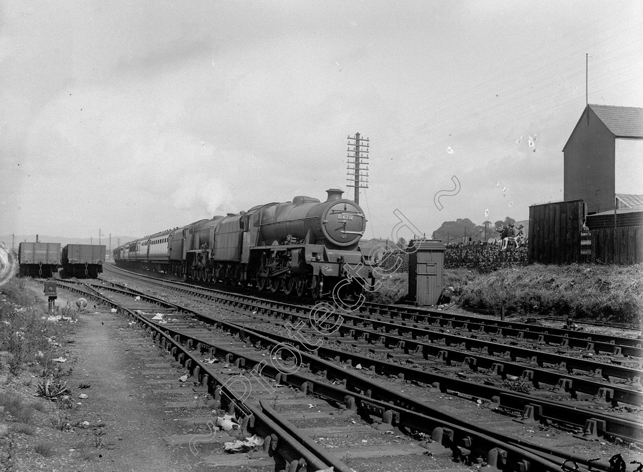 WDDH0953 
 ENGINE CLASS: Double Headed ENGINE NUMBER: 6169, 5675 LOCATION: Carnforth DATE: 28 July 1938 COMMENTS: 
 Keywords: 28 July 1938, 5675, 6169, Carnforth, Cooperline, Double Headed, Steam, WD Cooper, locomotives, railway photography, trains