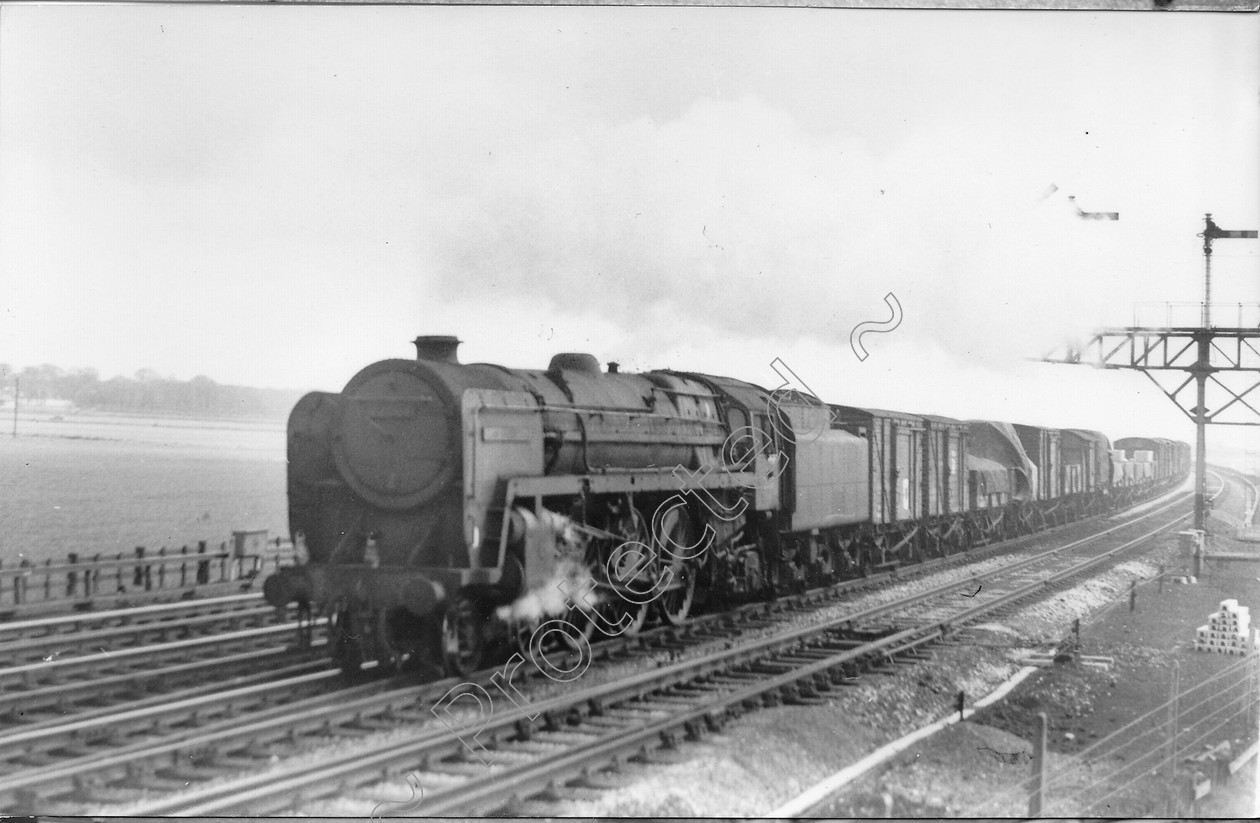 WD1389 
 ENGINE CLASS: Clan Class ENGINE NUMBER: 72007 LOCATION: Winwick DATE: 17 April 1964 COMMENTS: 
 Keywords: 17 April 1964, 72007, Clan Class, Cooperline, Steam, WD Cooper, Winwick, locomotives, railway photography, trains