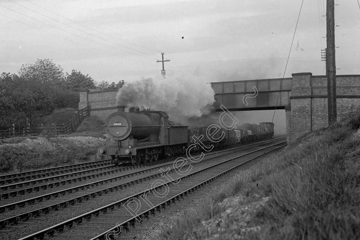 WD0817 
 ENGINE CLASS: Lancashire and Yorkshire ENGINE NUMBER: 12948 LOCATION: Moorside DATE: 26 May 1939 COMMENTS: 
 Keywords: 12948, 26 May 1939, Cooperline, Lancashire and Yorkshire, Moorside, Steam, WD Cooper, locomotives, railway photography, trains