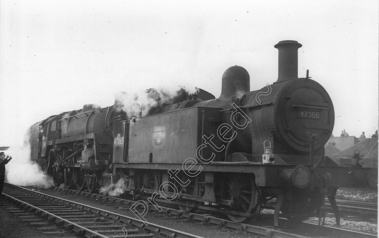 WD1352 
 ENGINE CLASS: 0-6-0 Tanks (Jinty) ENGINE NUMBER: 47365 LOCATION: Patricroft DATE: 18 April 1959 COMMENTS: Owing to bad rail manufaturer, 4.6.0 was unable to move. Jinty comes to assist. The rail joint was so sunken, it allowed the driving wheel to drop and jam against the brake blocks. 
 Keywords: 0-6-0 Tanks (Jinty), 18 April 1959, 47365, Cooperline, Owing to bad rail manufaturer, Patricroft, Steam, WD Cooper, locomotives, railway photography, trains