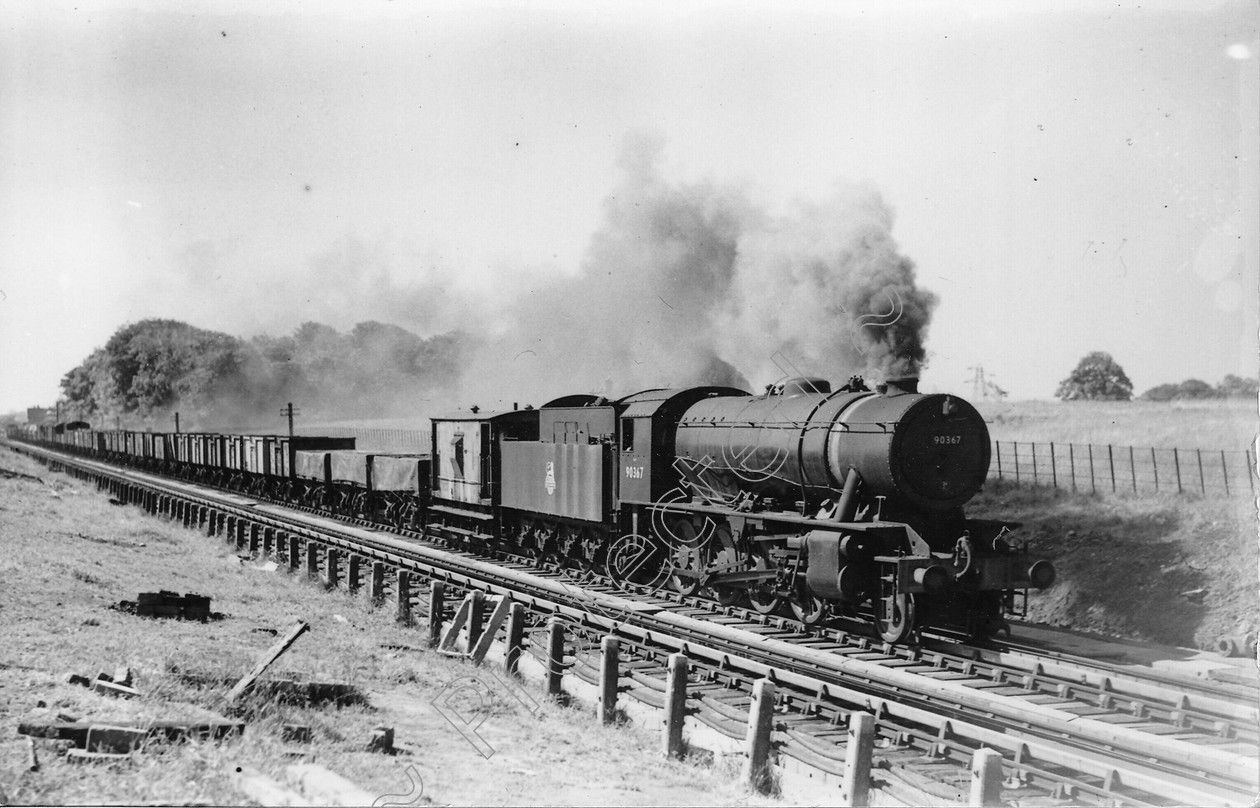 WD2521 
 ENGINE CLASS: Riddles 2-8-0 90000 ENGINE NUMBER: 90387 LOCATION: Brock Troughs DATE: 00.06.1957 COMMENTS: 
 Keywords: 00.06.1957, 90387, Brock Troughs, Cooperline, Riddles 2-8-0 90000, Steam, WD Cooper, locomotives, railway photography, trains