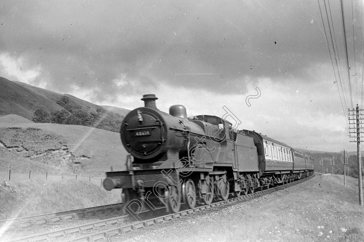 WD0569 
 ENGINE CLASS: Class 2 4-4-0 ENGINE NUMBER: 40618 LOCATION: Menoch, near Dumfries DATE: 10 August 1950 COMMENTS: 
 Keywords: 10 August 1950, 40618, Class 2 4-4-0, Cooperline, Menoch, Steam, WD Cooper, locomotives, near Dumfries, railway photography, trains