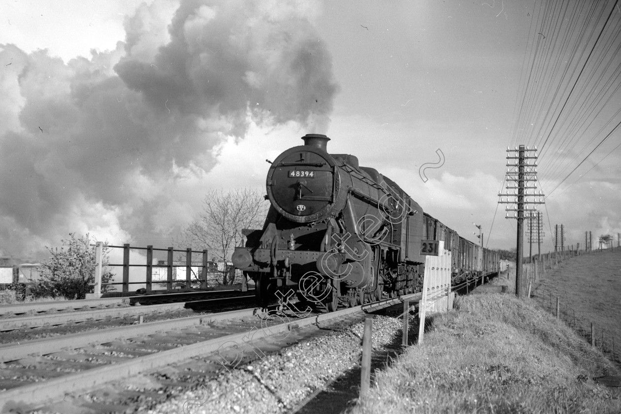 WD2041 
 ENGINE CLASS: Stanier Class 8 2-8-0 ENGINE NUMBER: 48394 LOCATION: Hellifield DATE: 25 June 1962 COMMENTS: 
 Keywords: 25 June 1962, 48394, Cooperline, Hellifield, Stanier Class 8 2-8-0, Steam, WD Cooper, locomotives, railway photography, trains