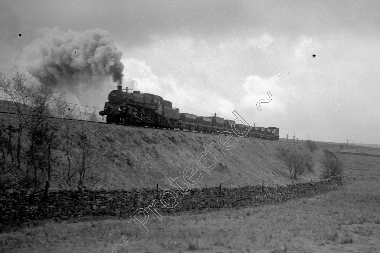 WD2485 
 ENGINE CLASS: BR 75000 4-6-0 ENGINE NUMBER: 75037 LOCATION: Shap Bank DATE: 09 May 1967 COMMENTS: 
 Keywords: 09 May 1967, 75037, BR 75000 4-6-0, Cooperline, Shap bank, Steam, WD Cooper, locomotives, railway photography, trains