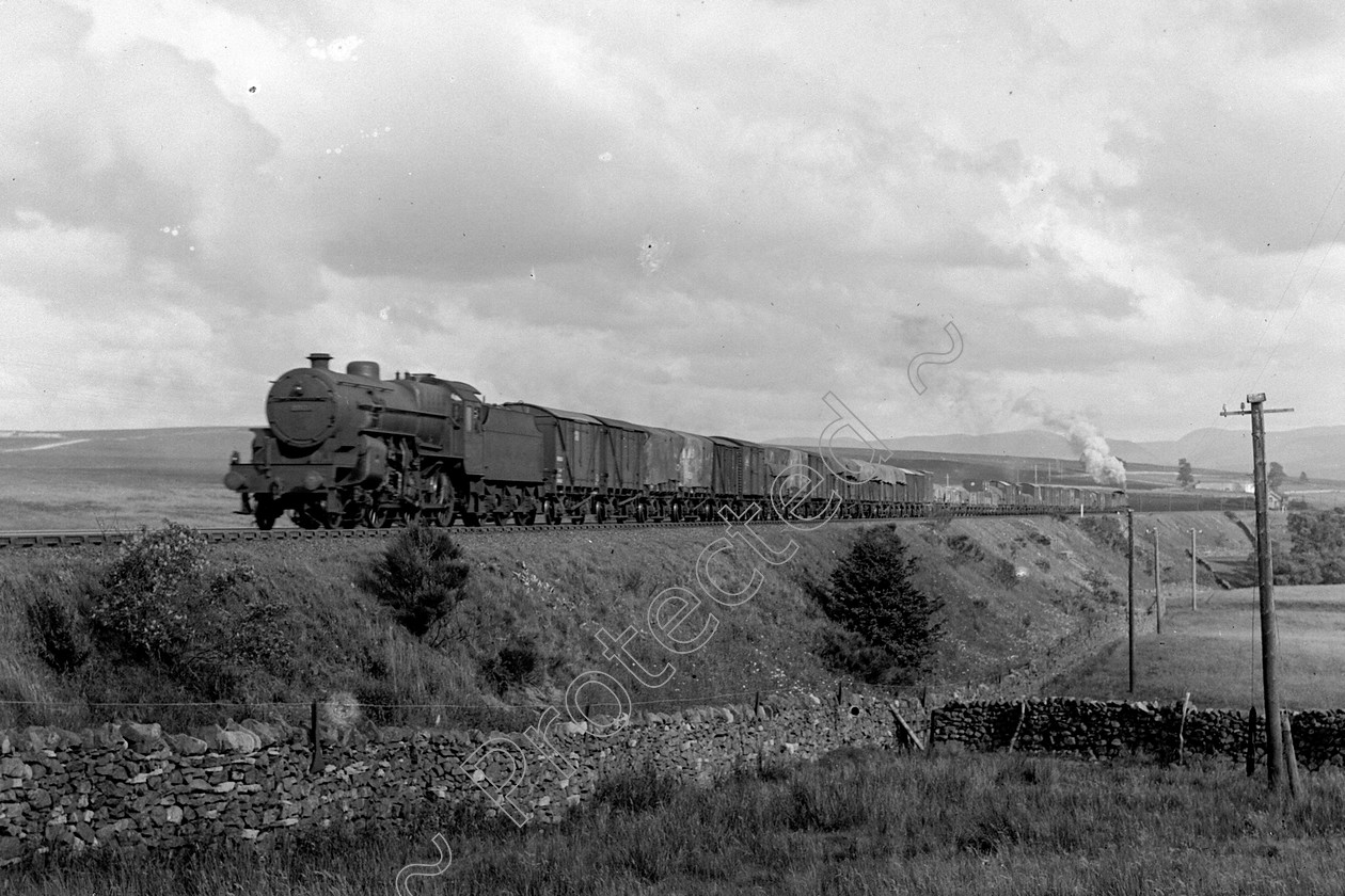 WD0602 
 ENGINE CLASS: Moguls 2-6-0 ENGINE NUMBER: 2920 LOCATION: Shap bank DATE: 26 July 1938 COMMENTS: 
 Keywords: 26 July 1938, 2920, Cooperline, Moguls 2-6-0, Shap bank, Steam, WD Cooper, locomotives, railway photography, trains