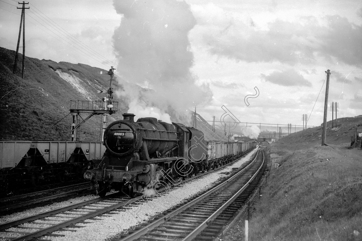 WD2001 
 ENGINE CLASS: Stanier Class 8 2-8-0 ENGINE NUMBER: 48003 LOCATION: Peak Forest DATE: 16 May 1962 COMMENTS: 
 Keywords: 16 May 1962, 48003, Cooperline, Peak Forest, Stanier Class 8 2-8-0, Steam, WD Cooper, locomotives, railway photography, trains