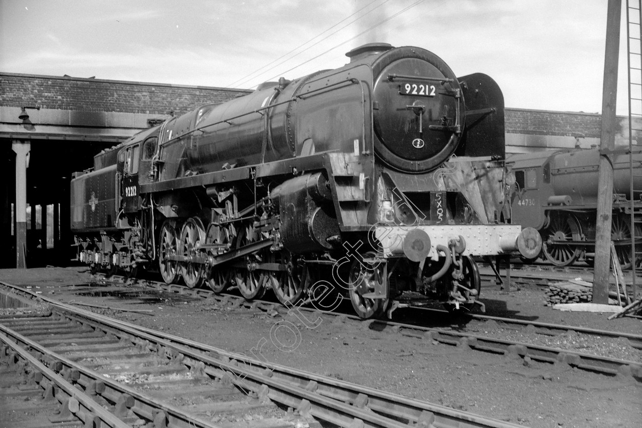 WD2682 
 ENGINE CLASS: BR Class 9 ENGINE NUMBER: 92212 LOCATION: Carnforth DATE: 25 August 1964 COMMENTS: 
 Keywords: 25 August 1964, 92212, BR Class 9, Carnforth, Cooperline, Steam, WD Cooper, locomotives, railway photography, trains