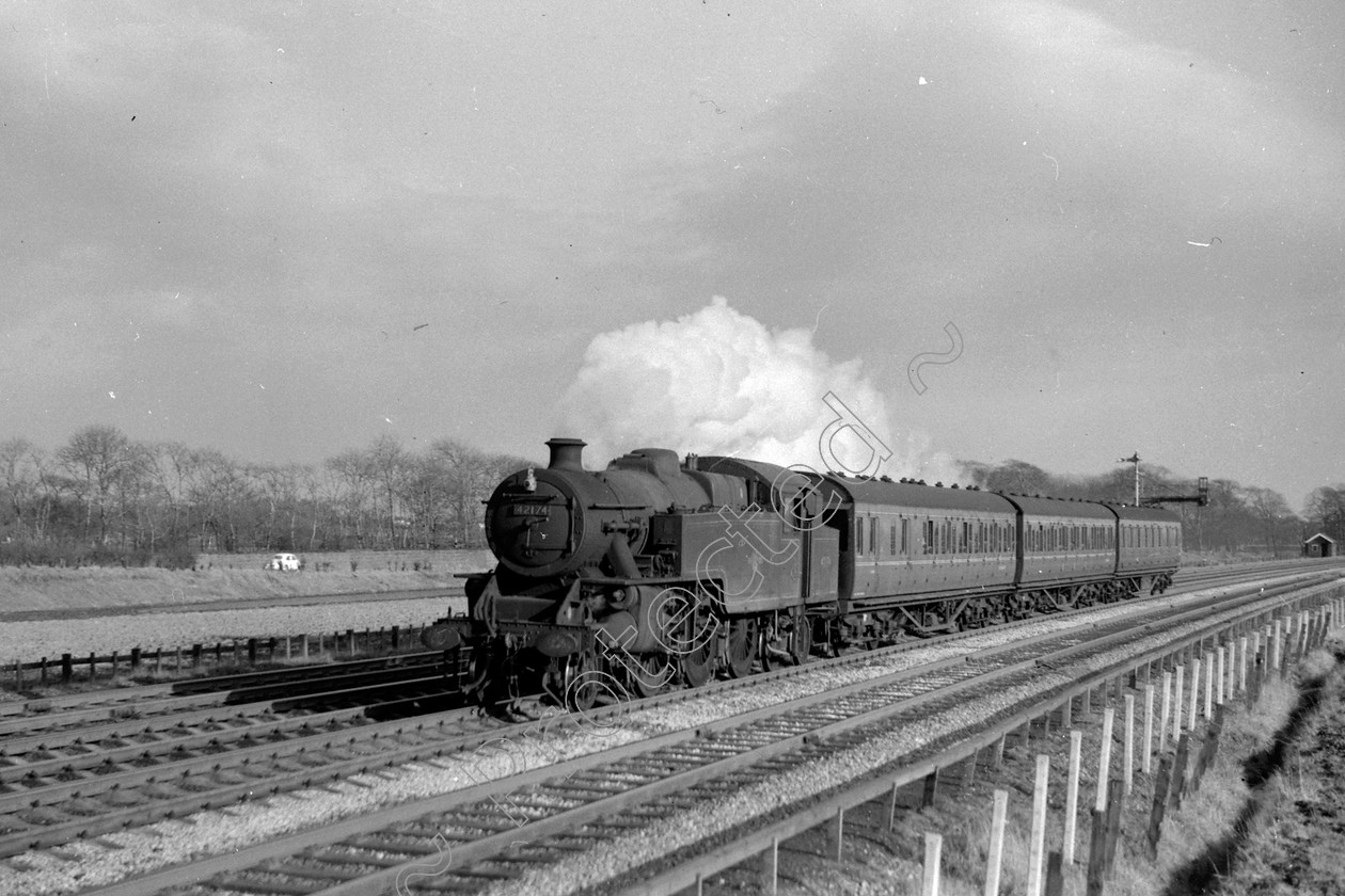 WD1015 
 ENGINE CLASS: 2-6-4 Tanks ENGINE NUMBER: 42174 LOCATION: Winwick DATE: 25 March 1964 COMMENTS: 
 Keywords: 2-6-4 Tanks, 25 March 1964, 42174, Cooperline, Steam, WD Cooper, Winwick, locomotives, railway photography, trains