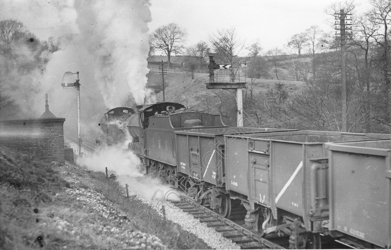 WD0719 
 ENGINE CLASS: Class 4 0-6-0 ENGINE NUMBER: 44015, 4196 LOCATION: Disley DATE: 09 April 1949 COMMENTS: 
 Keywords: 09 April 1949, 4196, 44015, Class 4 0-6-0, Cooperline, Disley, Steam, WD Cooper, locomotives, railway photography, trains