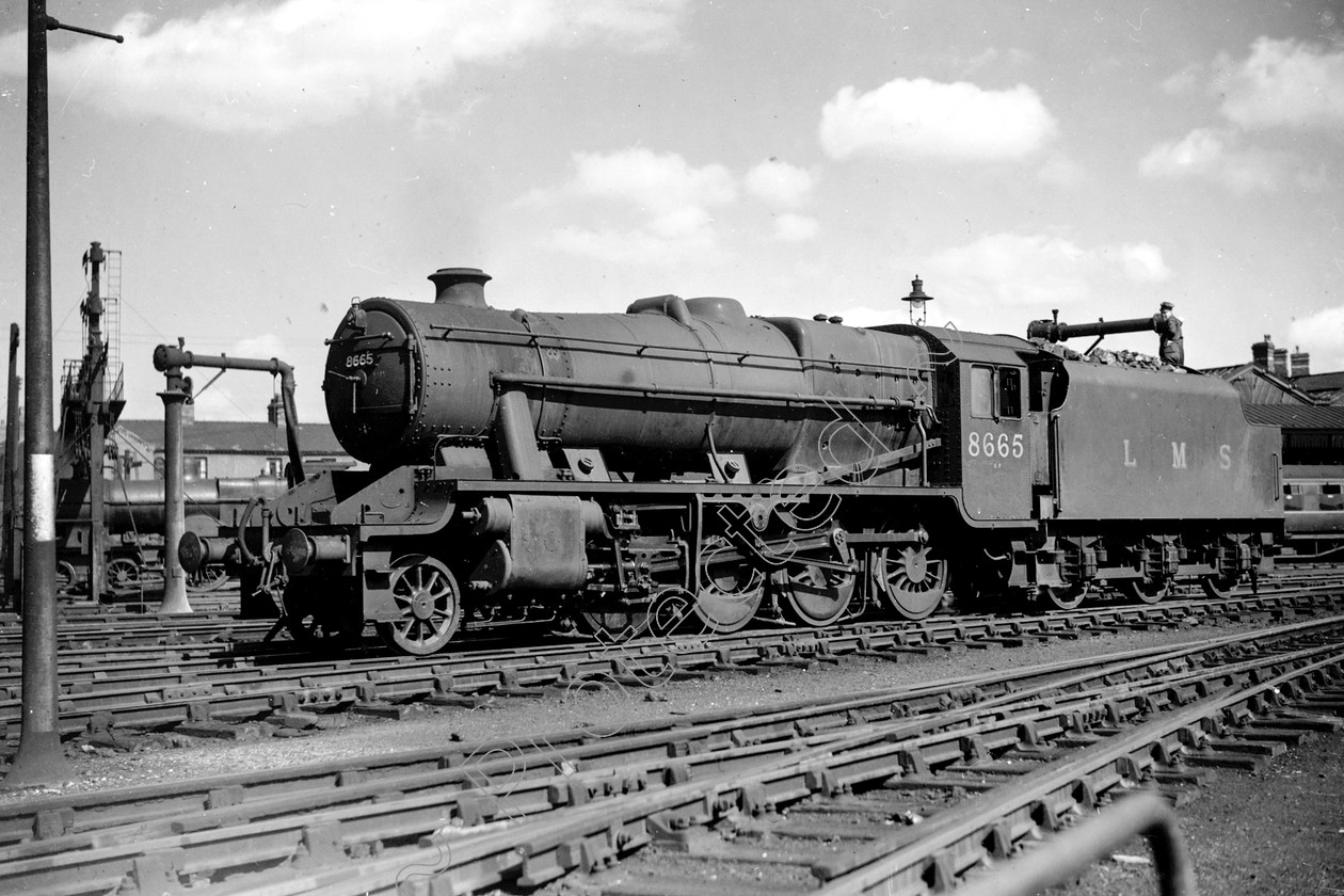 WD2069 
 ENGINE CLASS: Stanier Class 8 2-8-0 ENGINE NUMBER: 8665 LOCATION: Stafford DATE: 25 August 1948 COMMENTS: 
 Keywords: 25 August 1948, 8665, Cooperline, Stafford, Stanier Class 8 2-8-0, Steam, WD Cooper, locomotives, railway photography, trains