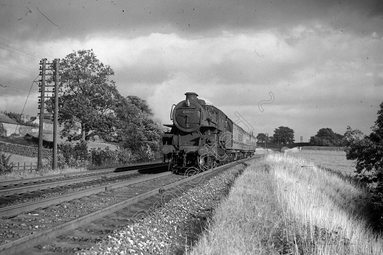 WD0895 
 ENGINE CLASS: Ivatt 6400 & 3000 ENGINE NUMBER: 43034 LOCATION: Long Preston DATE: 00.07.1952 COMMENTS: 
 Keywords: 00.07.1952, 43034, Cooperline, Ivatt 6400 & 3000, Long Preston, Steam, WD Cooper, locomotives, railway photography, trains