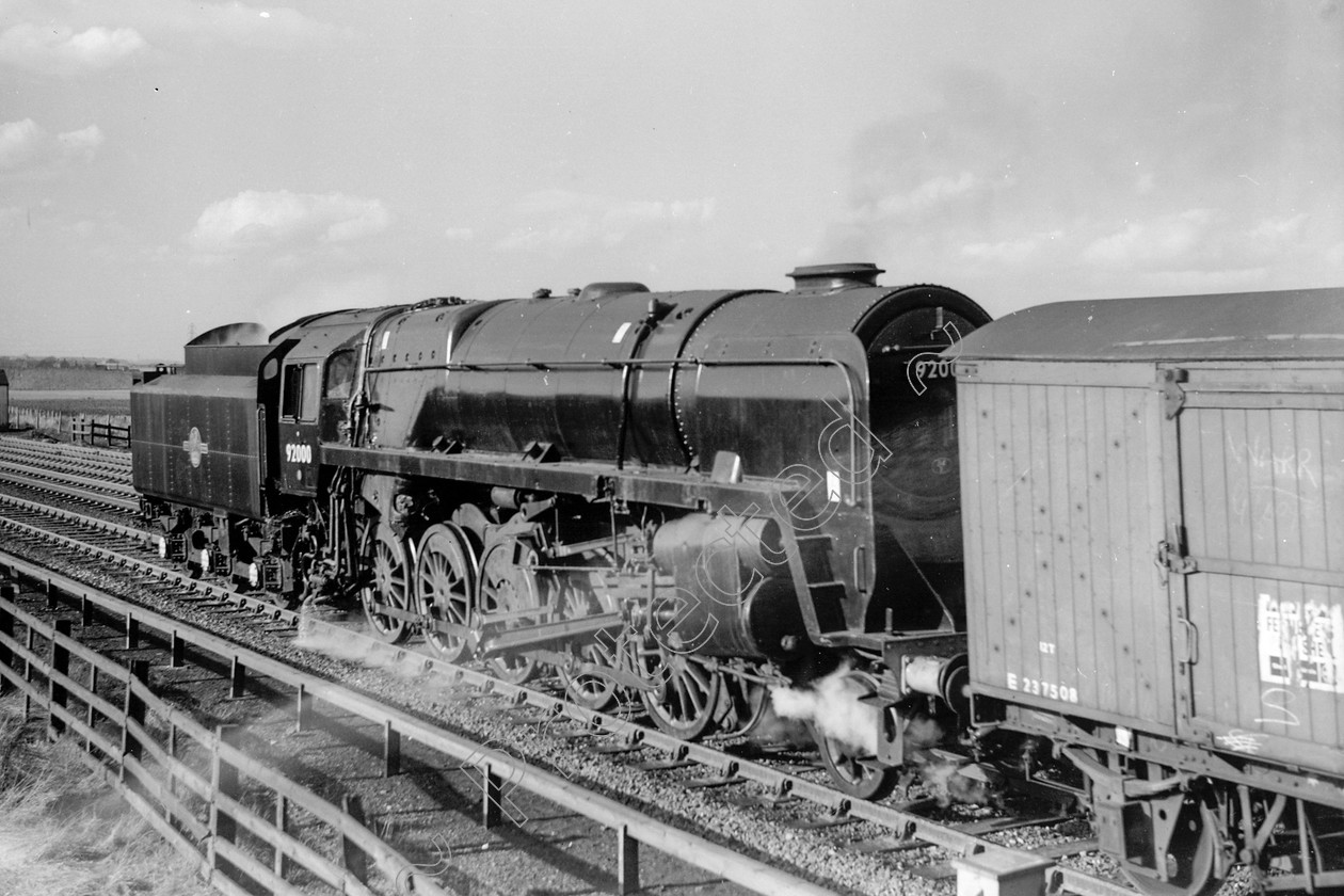 WD2601 
 ENGINE CLASS: BR Class 9 ENGINE NUMBER: 92000 LOCATION: Winwick DATE: 15 March 1963 COMMENTS: 
 Keywords: 15 March 1963, 92000, BR Class 9, Cooperline, Steam, WD Cooper, Winwick, locomotives, railway photography, trains