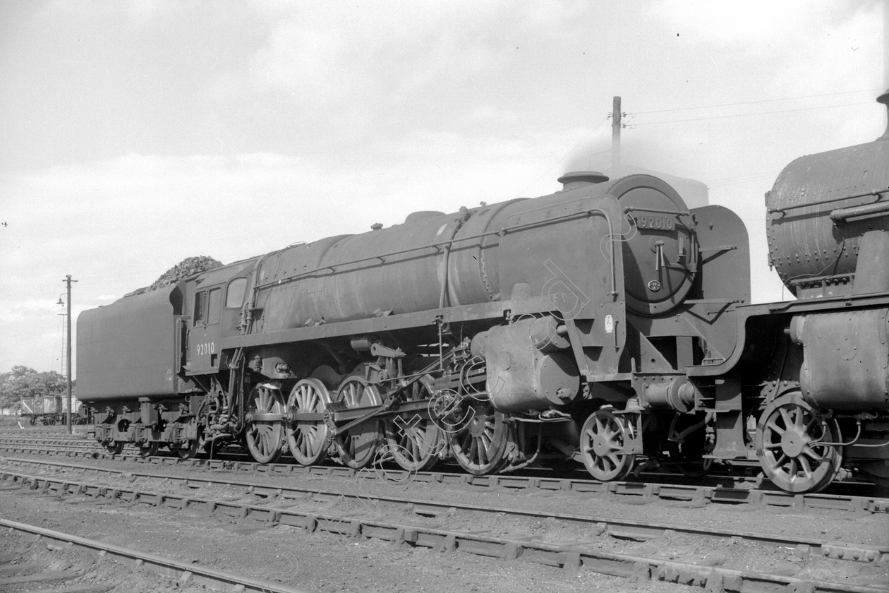 WD2608 
 ENGINE CLASS: BR Class 9 ENGINE NUMBER: 92010 LOCATION: Kingmoor DATE: 27 August 1964 COMMENTS: 
 Keywords: 27 August 1964, 92010, BR Class 9, Cooperline, Kingmoor, Steam, WD Cooper, locomotives, railway photography, trains