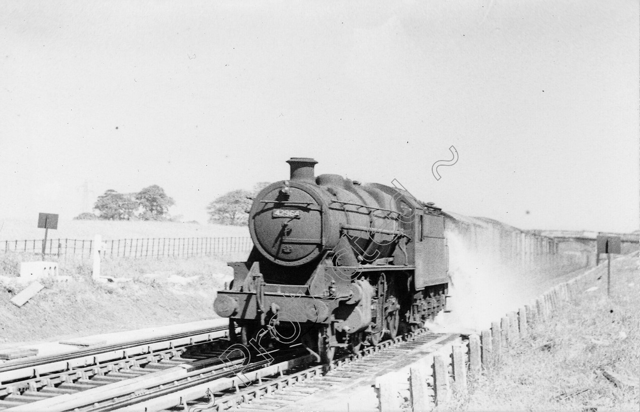 WD0677 
 ENGINE CLASS: Moguls 2-6-0 ENGINE NUMBER: 42964 LOCATION: Brock DATE: 00.06.1957 COMMENTS: 
 Keywords: 00.06.1957, 42964, Brock, Cooperline, Moguls 2-6-0, Steam, WD Cooper, locomotives, railway photography, trains