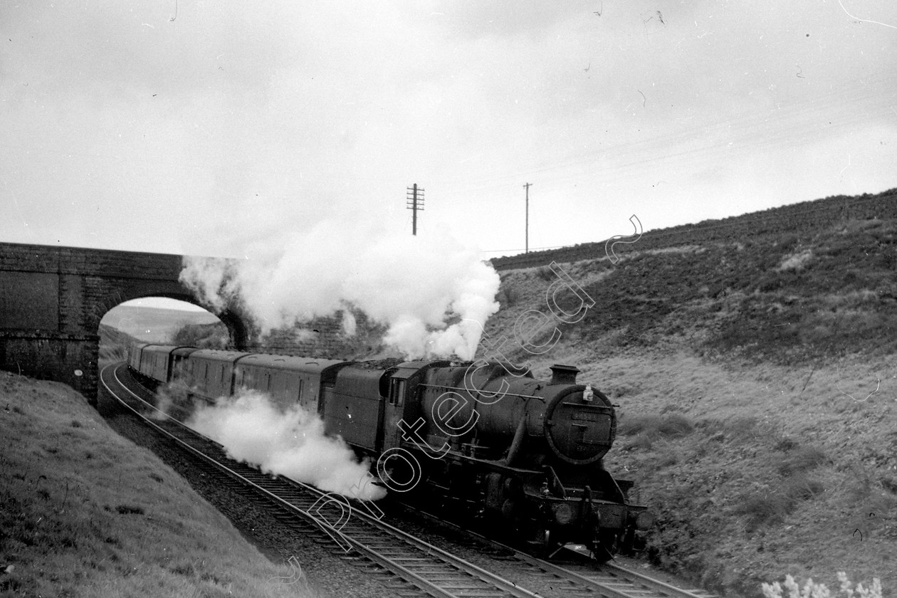 WD2058 
 ENGINE CLASS: Stanier Class 8 2-8-0 ENGINE NUMBER: 48523 LOCATION: Shap DATE: 04 May 1964 COMMENTS: 
 Keywords: 04 May 1964, 48523, Cooperline, Shap, Stanier Class 8 2-8-0, Steam, WD Cooper, locomotives, railway photography, trains