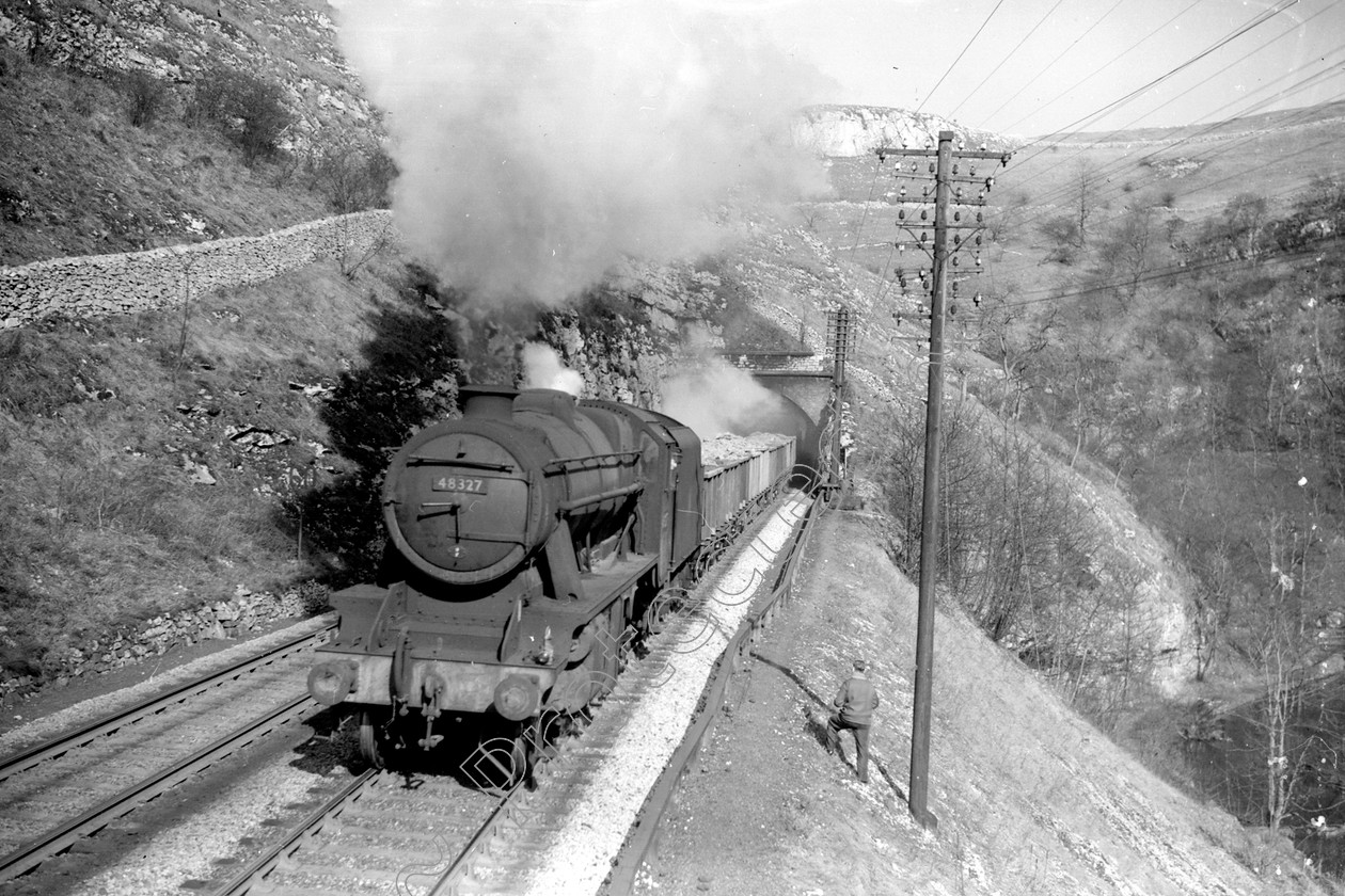 WD2034 
 ENGINE CLASS: Stanier Class 8 2-8-0 ENGINE NUMBER: 48327 LOCATION: Cheedale DATE: 23 March 1963 COMMENTS: 
 Keywords: 23 March 1963, 48327, Cheedale, Cooperline, Stanier Class 8 2-8-0, Steam, WD Cooper, locomotives, railway photography, trains